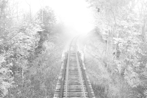 Railroad into fog. (unretouched) Twilight, Pennsylvania (black & white)
